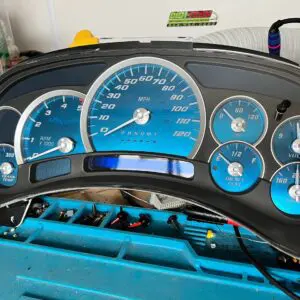 Blue automotive instrument cluster on table