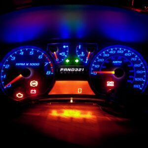 Glowing vehicle speedometer and tachometer
