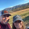 Happy pair outdoors with mountains